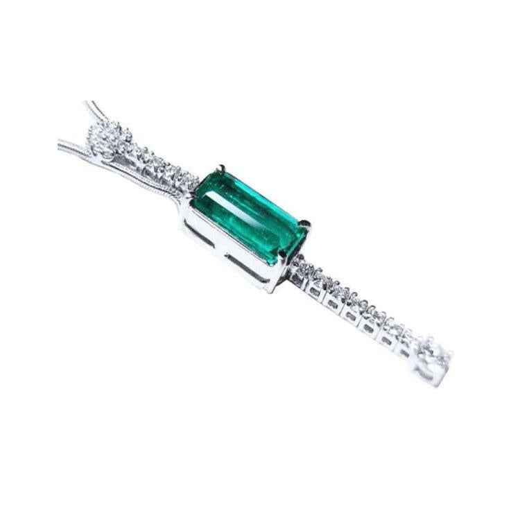 A rectangular natural colombian emerald and diamond necklace made of 14k white gold for women.