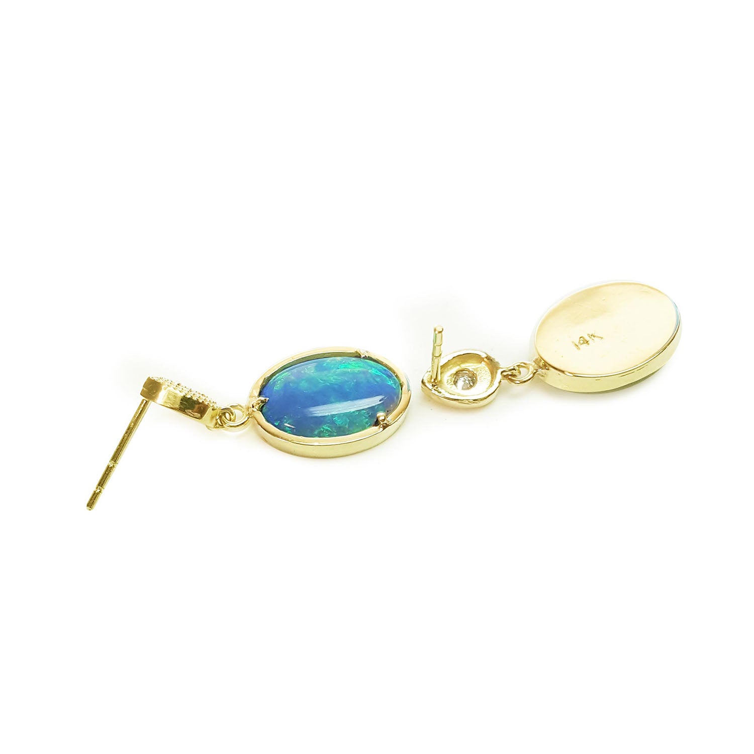 Gold earrings with a blue Australian opal on a white background