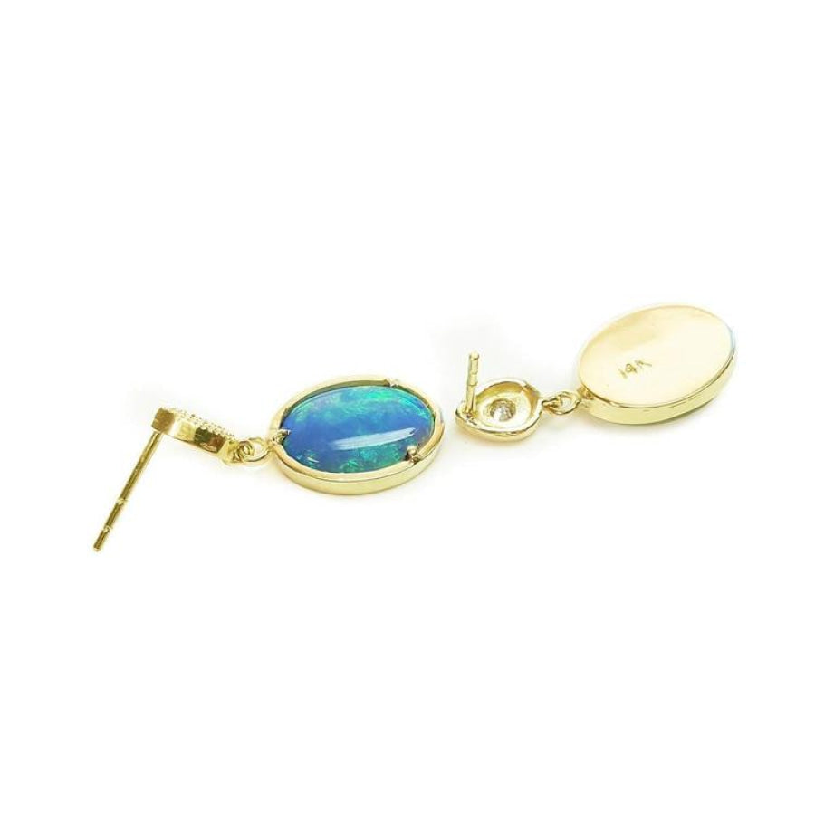 Oval bluish-green Australian opal earrings with dangling diamonds set in 14K yellow gold.