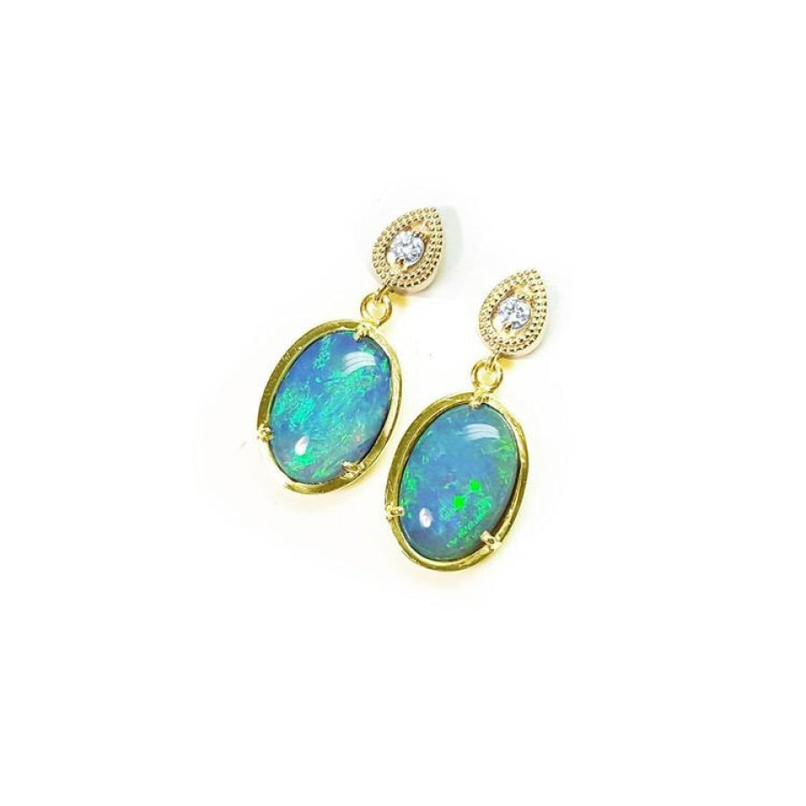 Oval Australian opal earrings with bluish-green play of color, dangling diamond studs, set in 14K yellow gold.