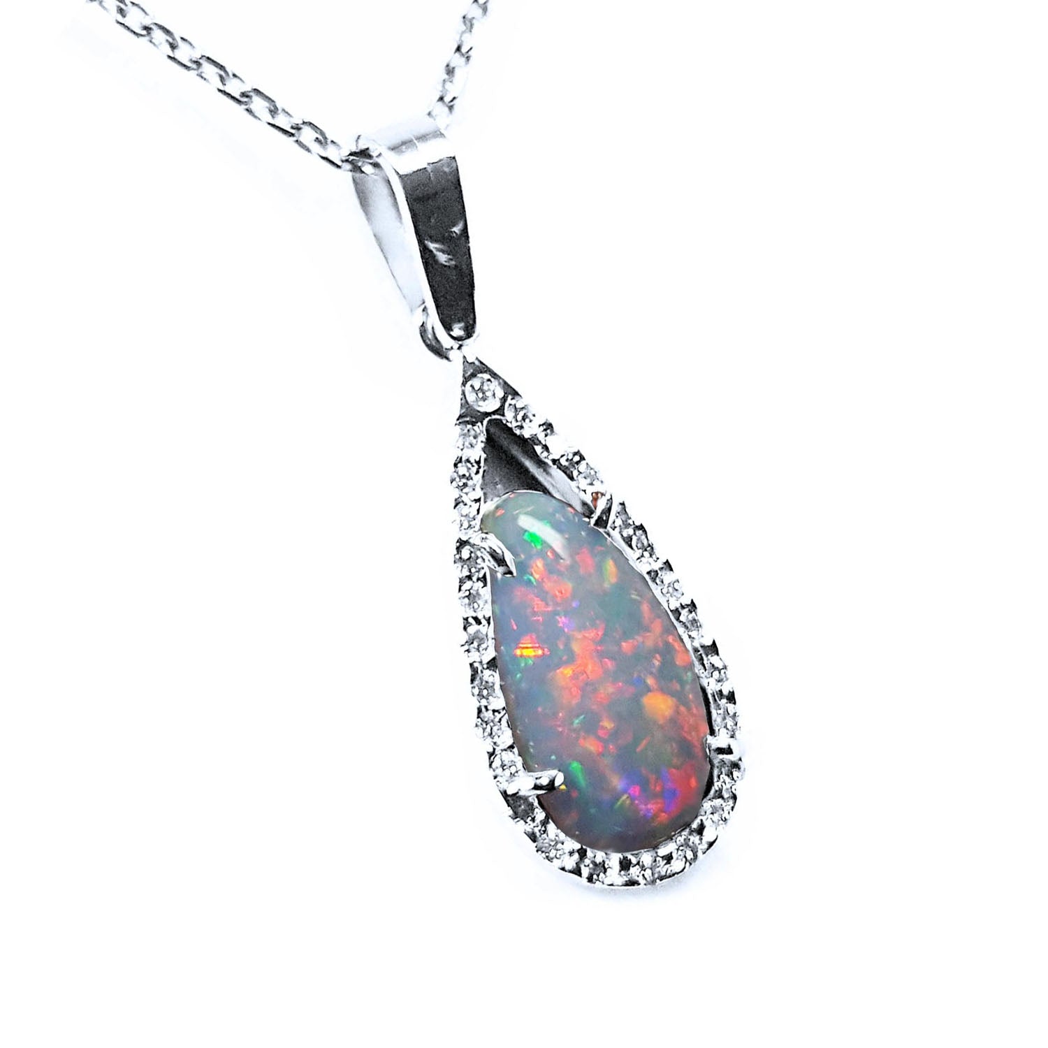 A solid natural Australian pear red opal surrounded by a halo diamond in white gold pendant, shows its right-side profile.