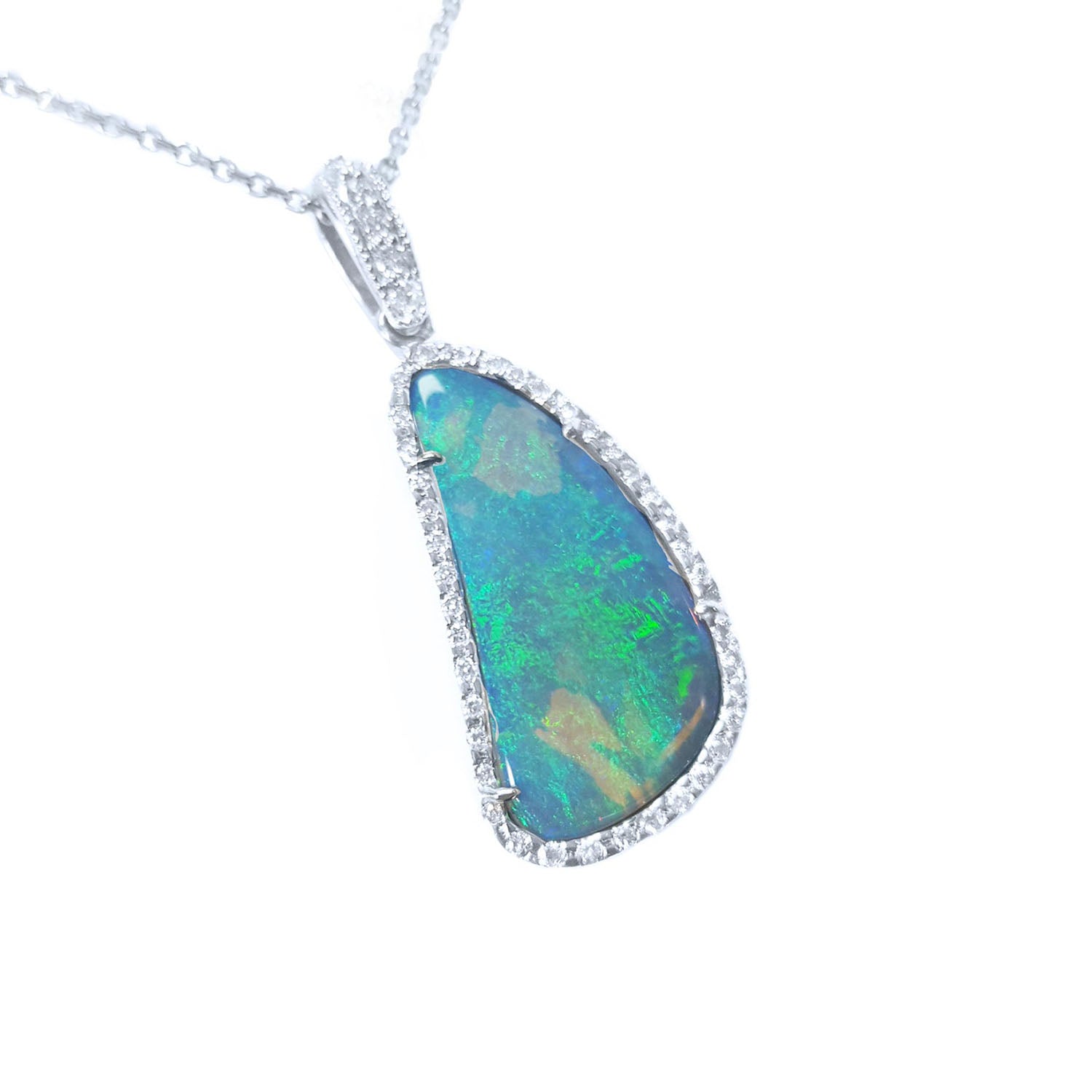 A solid Australian opal pendant necklace on a white gold and diamond frame displaying the topside.