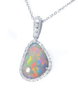A natural solid Australian opal pendant halo diamond white gold necklace on a topside view.