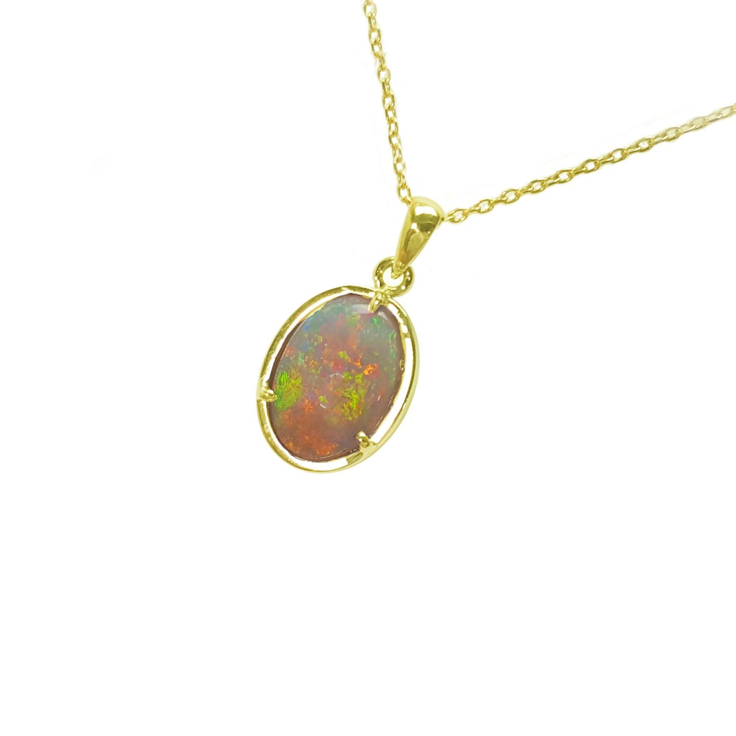 Opal pendant necklace on a gold chain against a white background