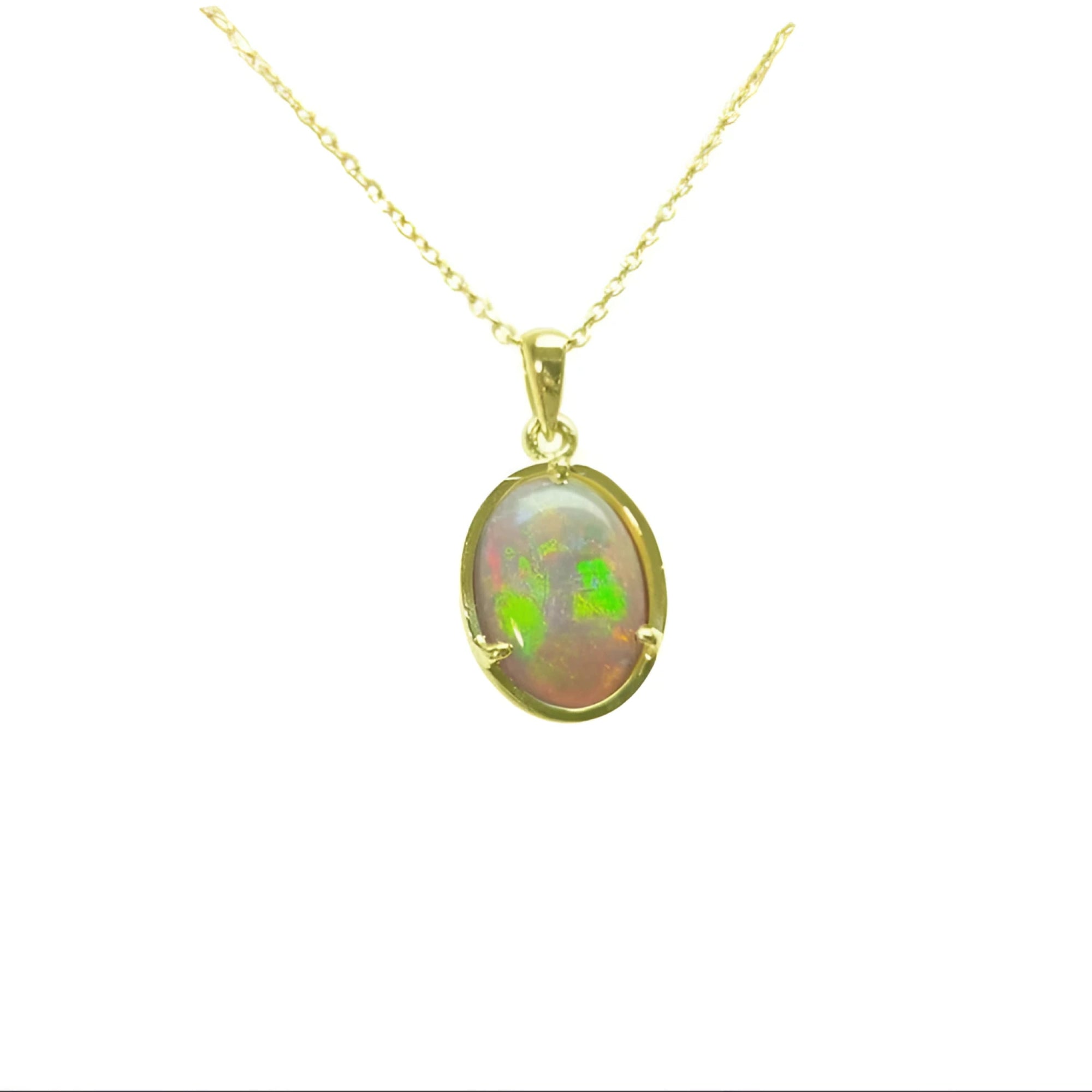 Oval Australian opal pendant with vibrant green and red play-of-color, set in 14k yellow gold on a delicate chain.