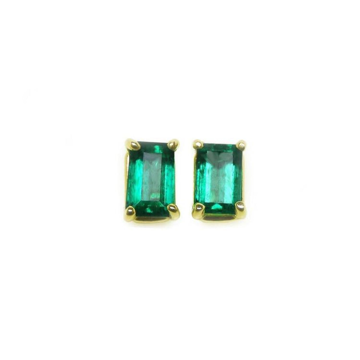 Pair of natural colombian emerald solitaire stud earrings made of 14kyellow gold.