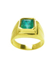Gold women's solitaire emerald ring with a bezel set natural colombian emerald, topside view