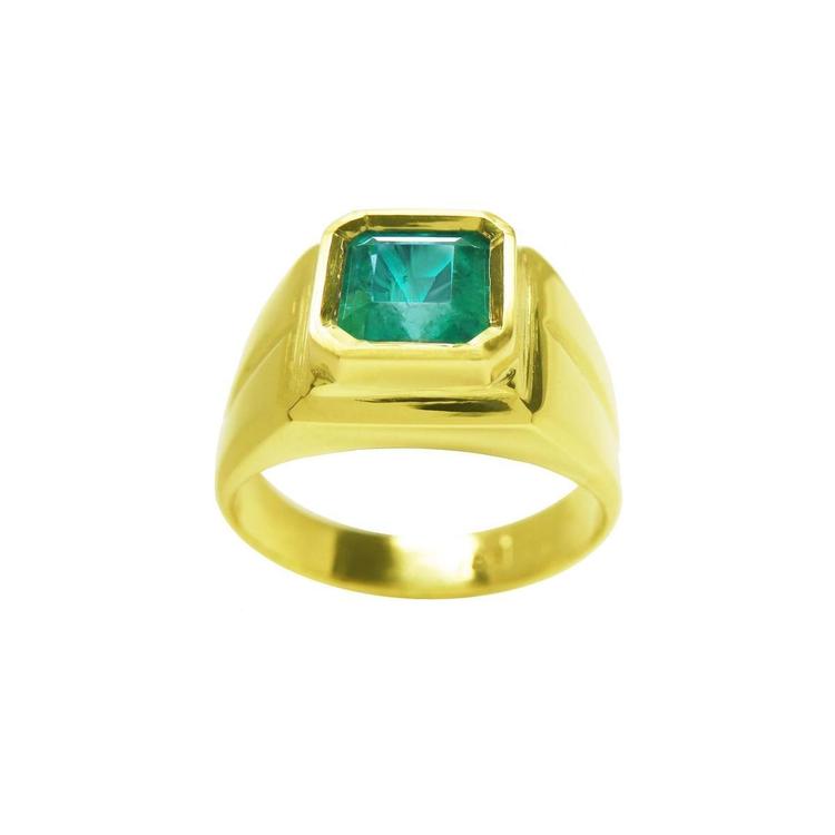 18k gold women's solitaire emerald ring with a bezel set natural colombian emerald, topside view