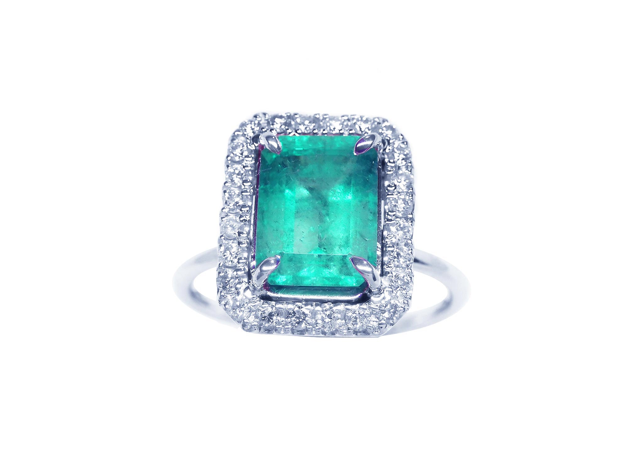 Emerald ring for women square halo diamond white gold, topside view.