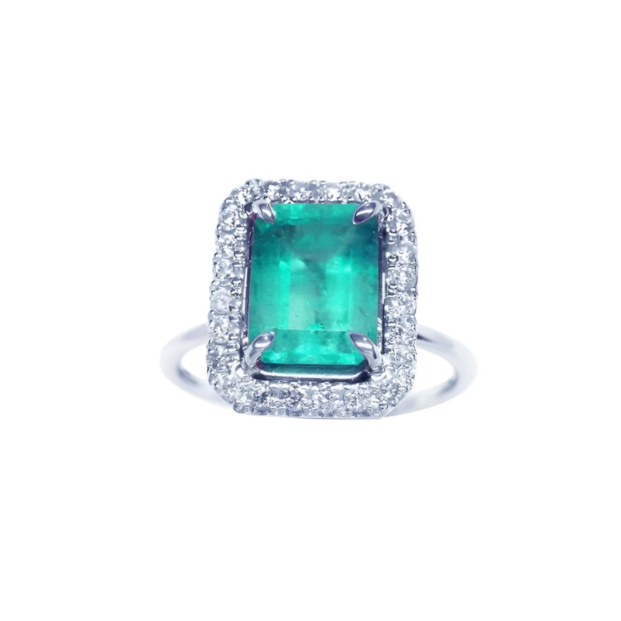A square emerald-cut emerald ring for women encircled by a halo diamond in 18k white gold.