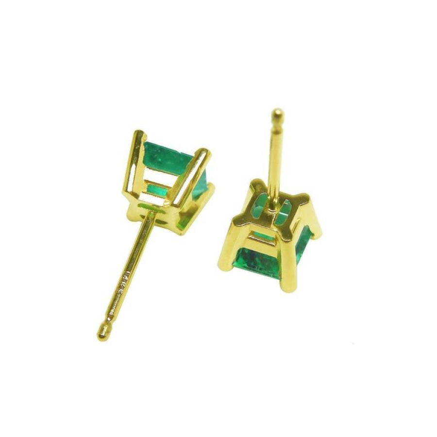 Pair of square emerald stud earrings in 14K yellow gold with basket settings.