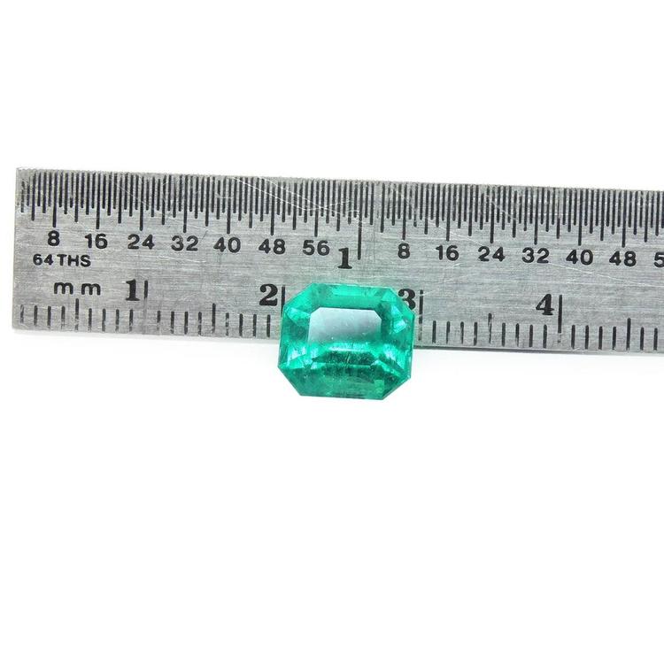 3.17 ct GIA certified natural Colombian Muzo Mine emerald, medium-deep green, shown with a ruler.