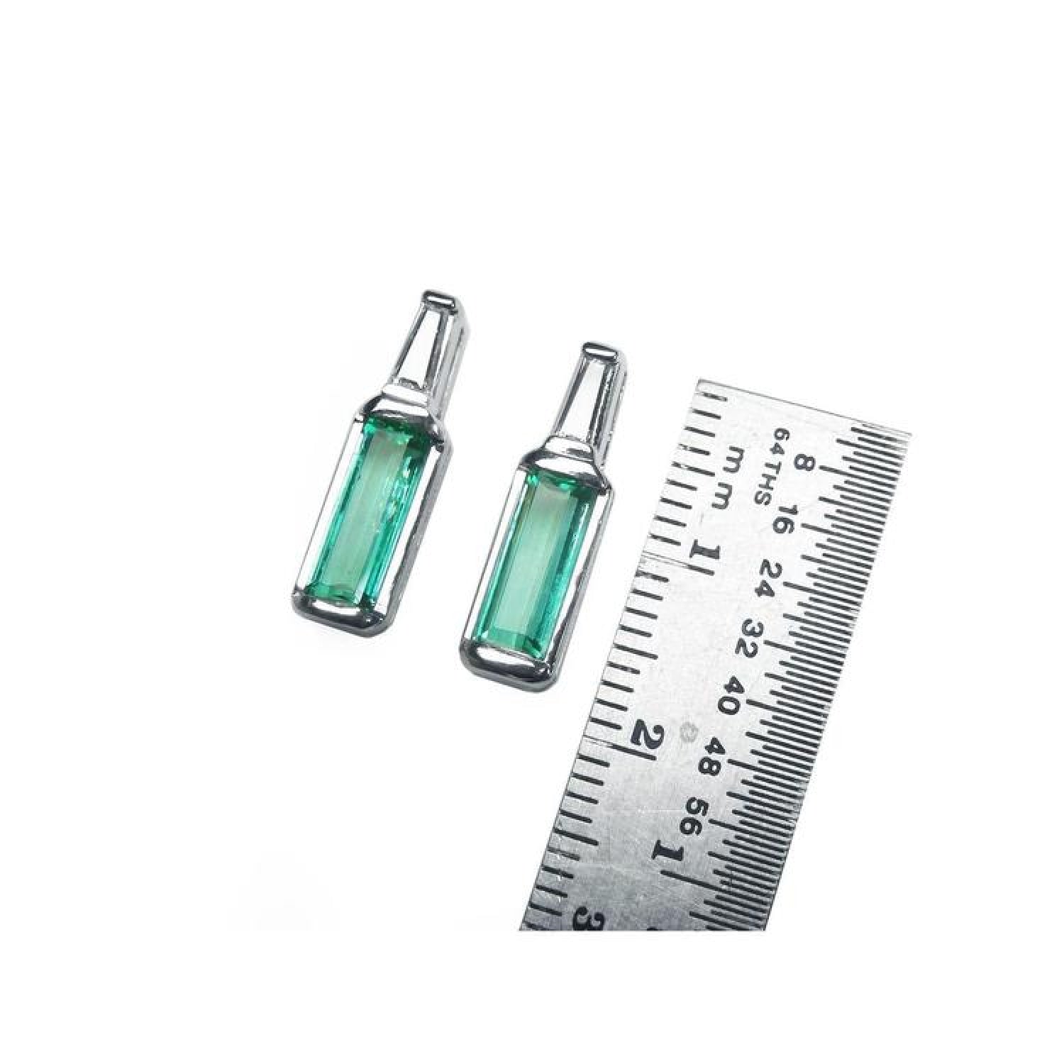 2.00 ct. natural baguette emerald stud earrings in 14k white gold with tapered baguette diamonds.