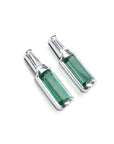A pair of baguette cut natural emerald stud earrings with tapered baguette diamonds on top, 14k white gold.