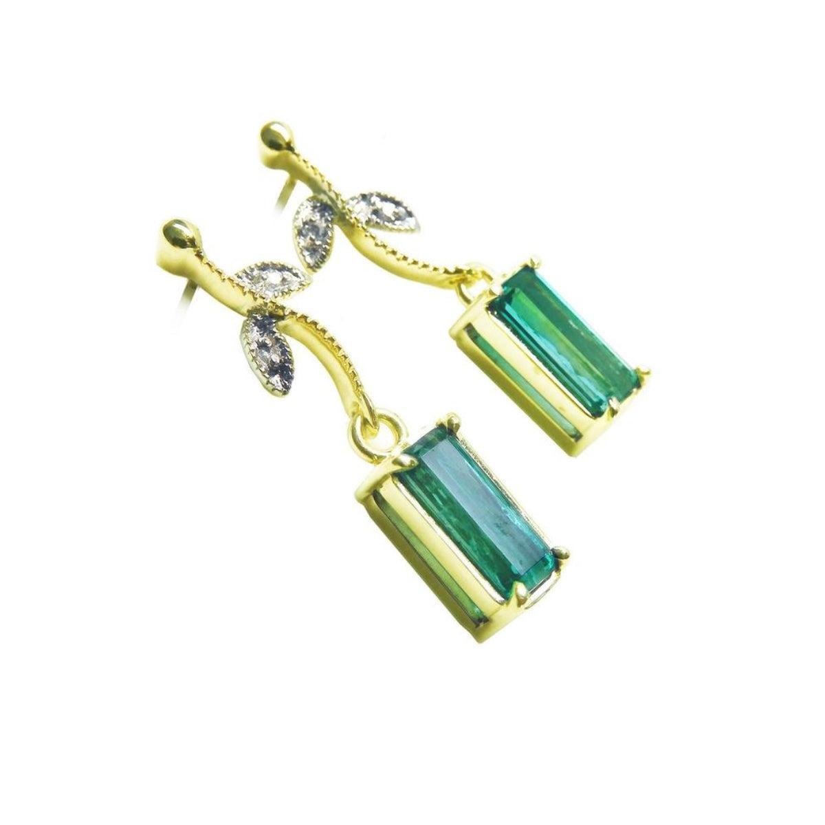 Right side of a pair of 14k yellow gold emerald earrings downside gallery profile view