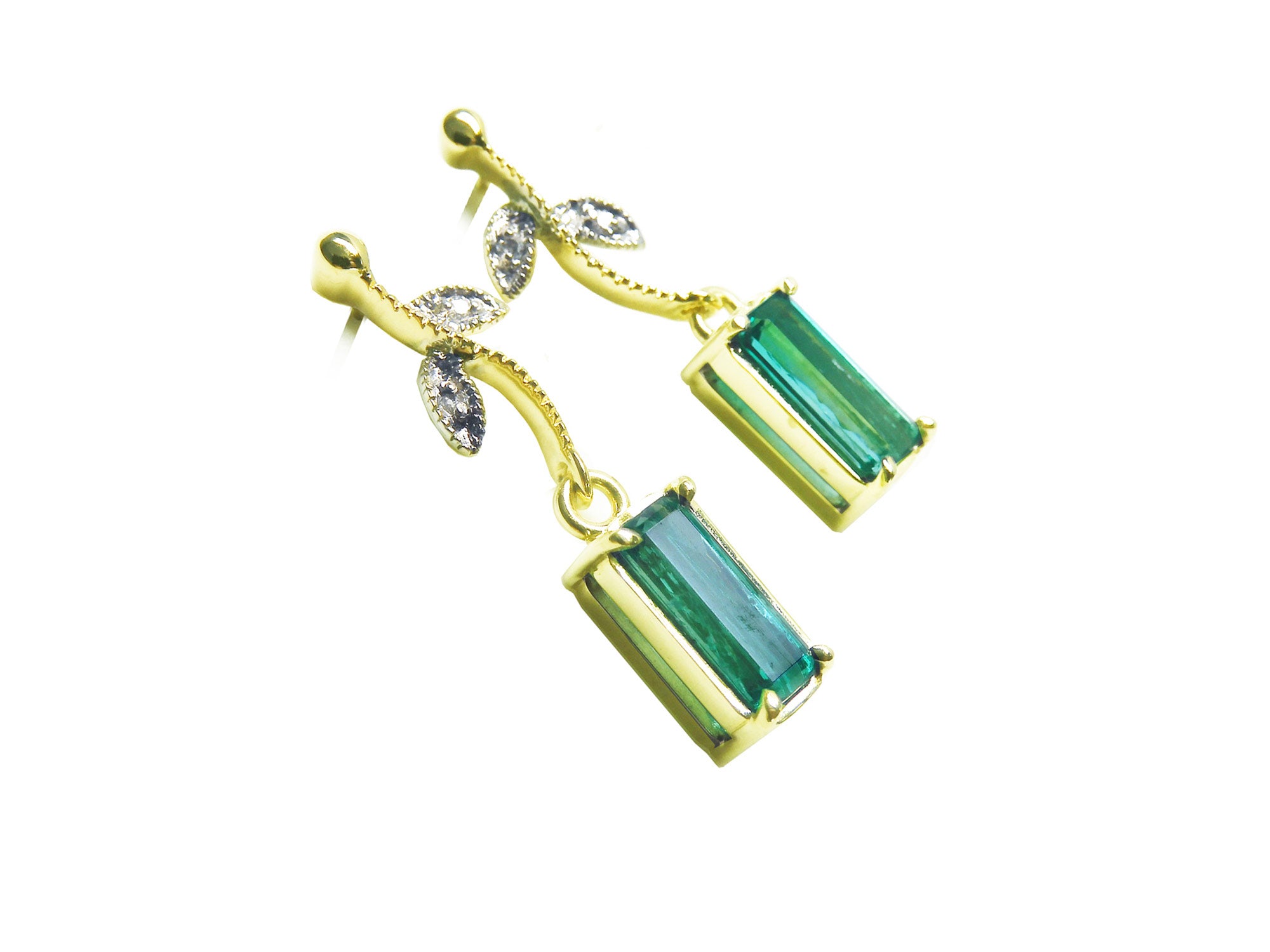Right side of a pair of 14k yellow gold emerald earrings downside gallery profile view