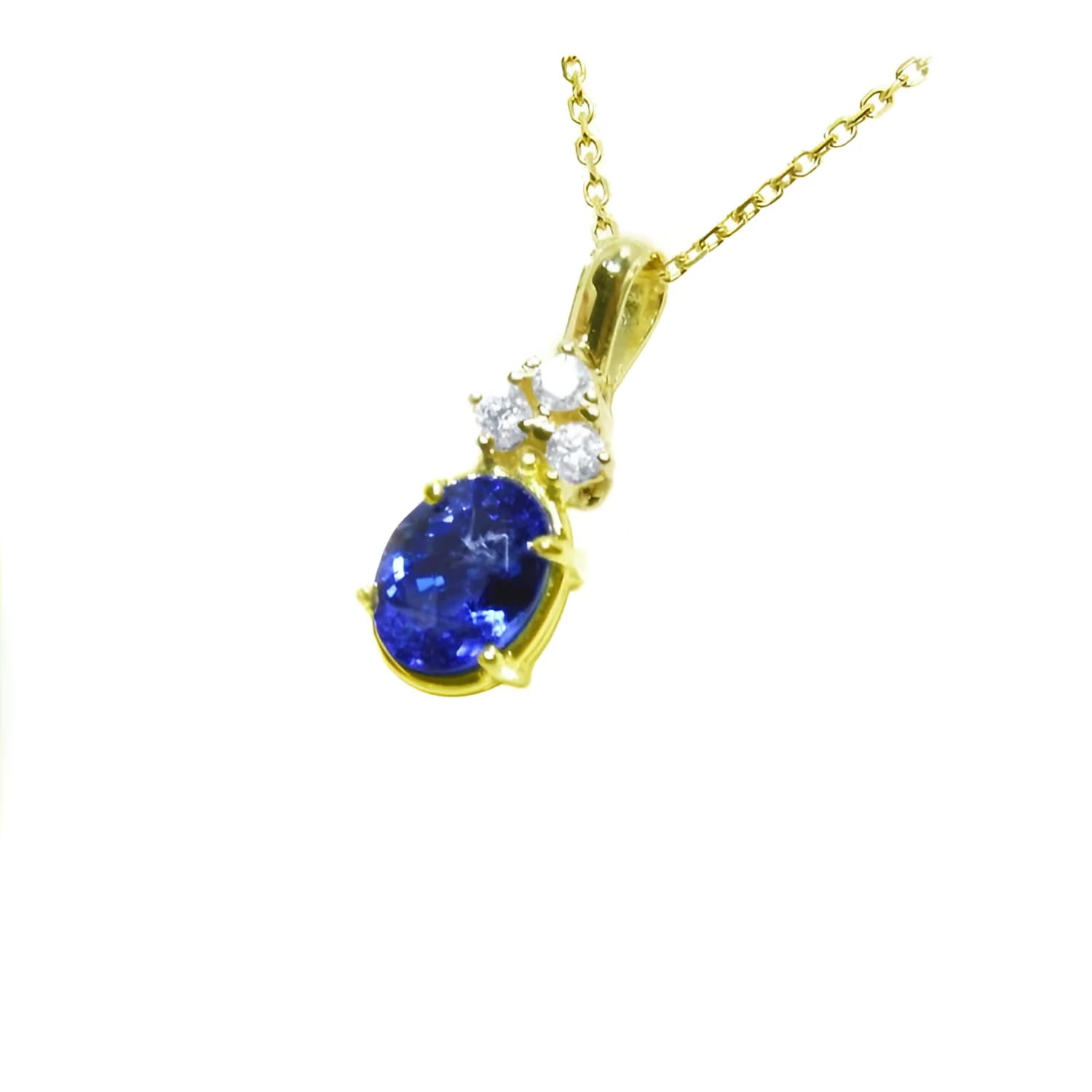 14K yellow gold pendant with oval tanzanite and three round diamonds.