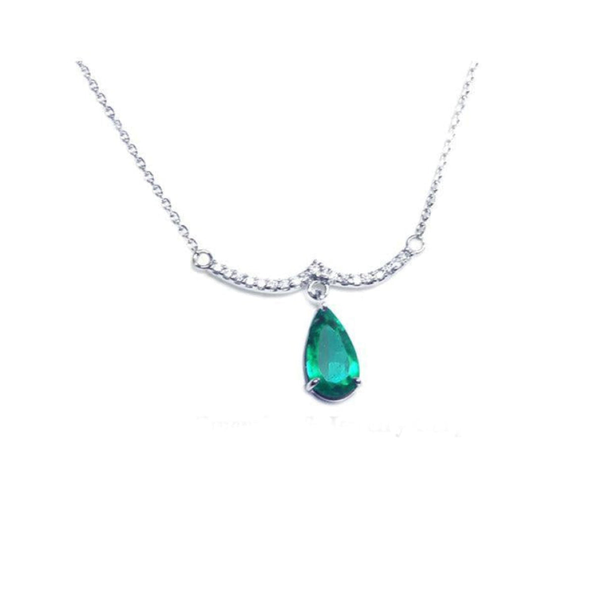 White gold necklace with a pear-shaped emerald dangling from a wavy bar with prong-set diamonds.