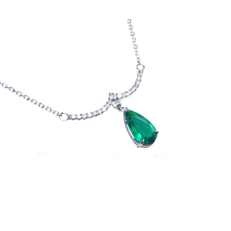 teardrop dangling emerald necklace natural Colombian emerald from a wavy central bar with diamonds pave set in 14k white gold