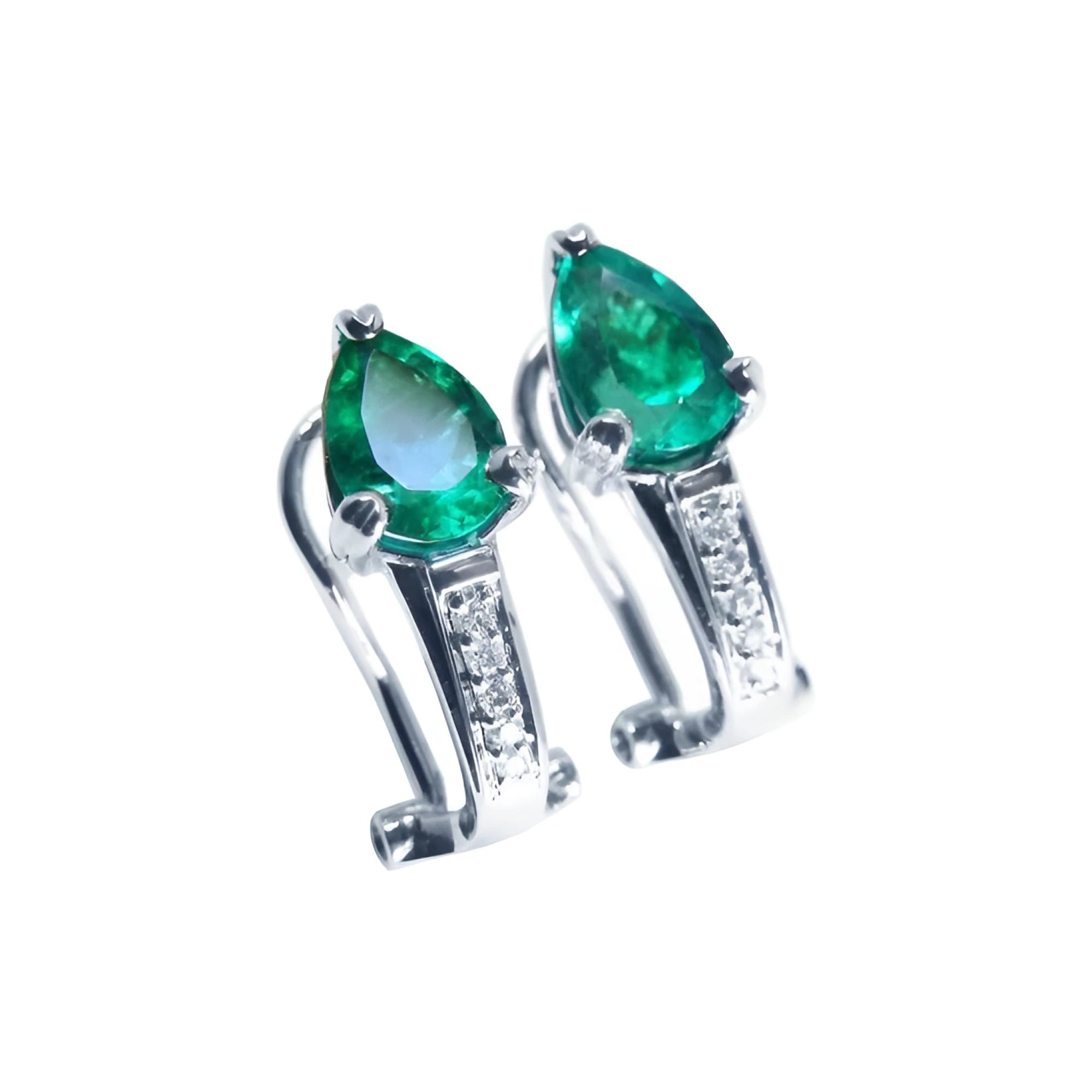 Pair of pear-shaped emerald clip-on earrings with diamond accents in 14K white gold.