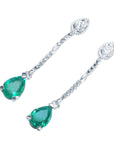 Left side position of a pair of a pear shaped emerald and diamond earrings top side view