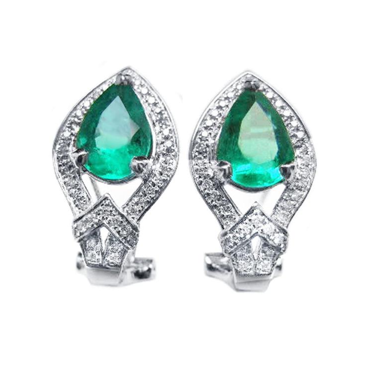 Pair of teardrop natural colombian emerald clip-on earrings with halo diamonds in 14k white gold.