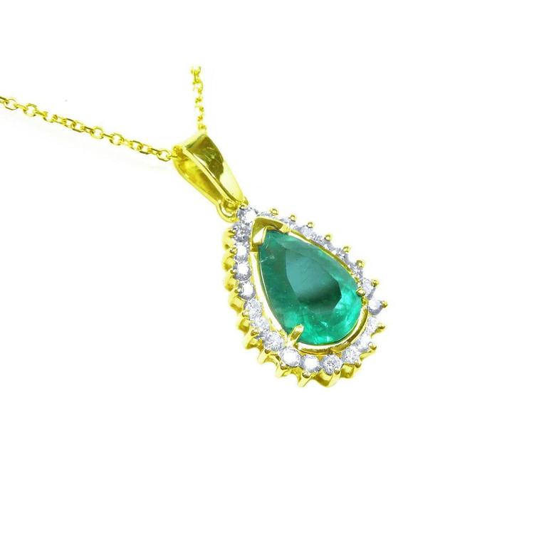 Gold pendant with a teardrop-shaped natural emerald surrounded by a halo of genuine diamonds