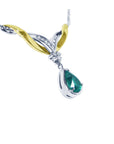 A lady's natural teardrop natural colombian emerald necklace crafted in 14k white and yellow gold.