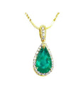 18K yellow gold teardrop emerald pendant with halo diamonds on a thin chain.
