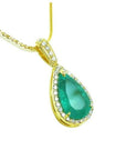 18k yellow gold necklace with a natural emerald teardrop halo diamond pendant. 