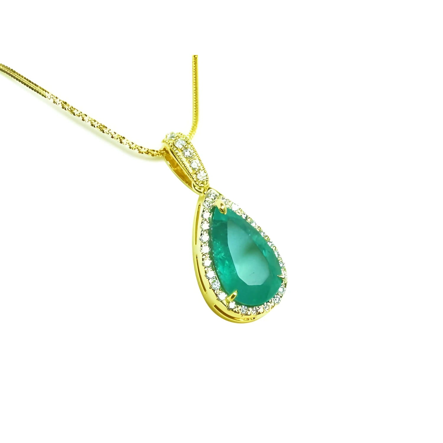 Gold necklace with a natural emerald teardrop pendant topside view on a white background