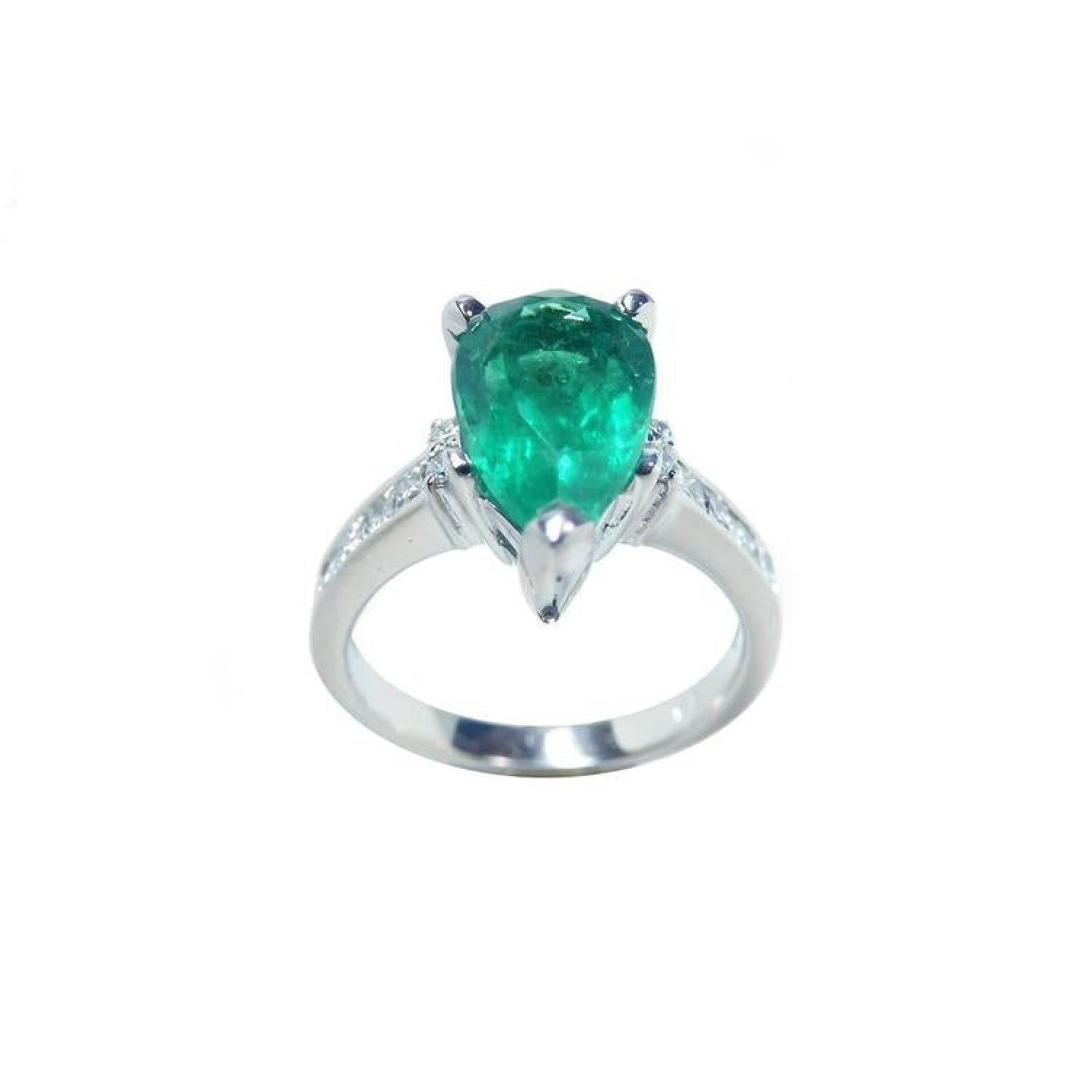 3.09 ct. pear-shaped deep green emerald ring with princess cut diamonds in 14K white gold.