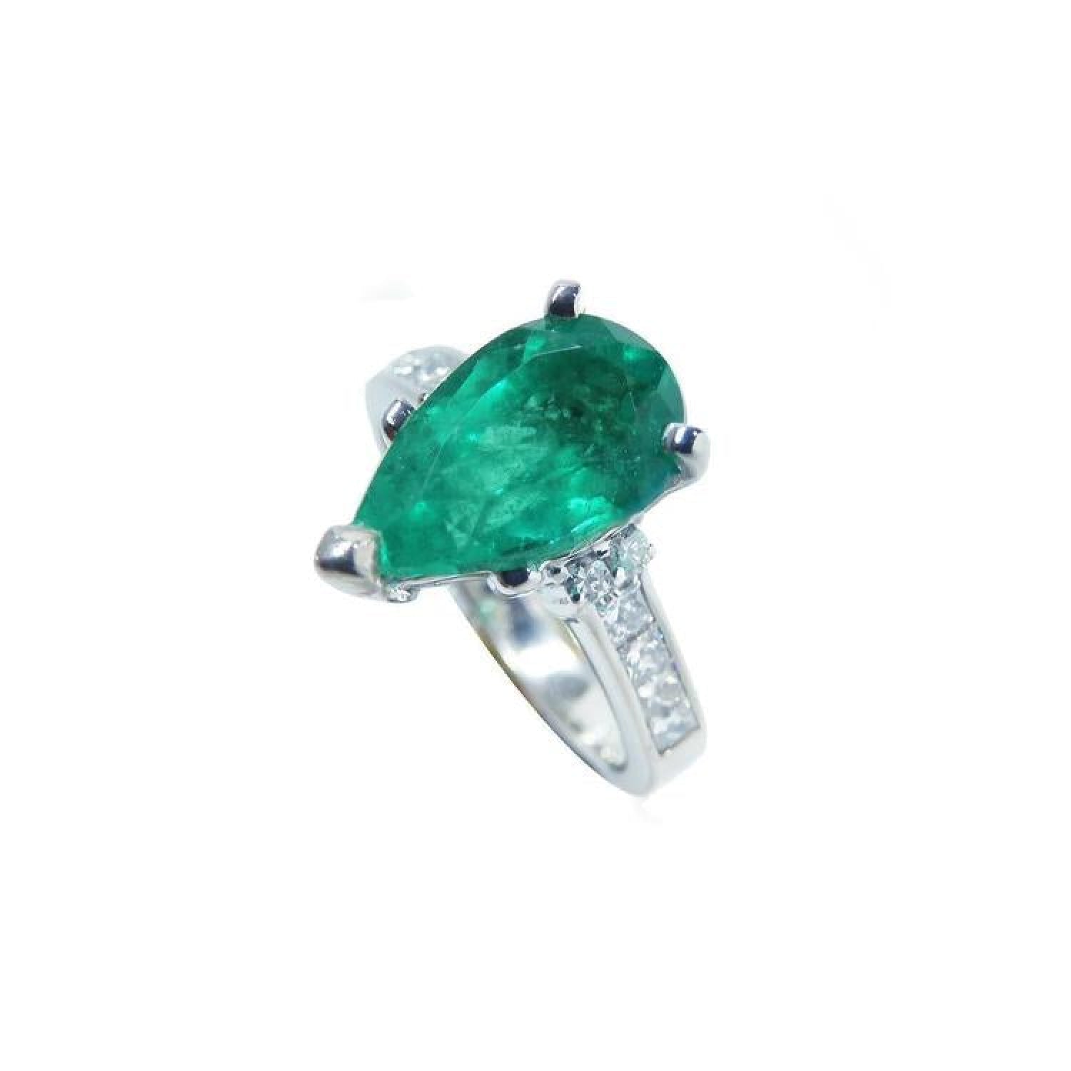 Pear-shaped deep green emerald ring with princess cut diamonds in 14K white gold.
