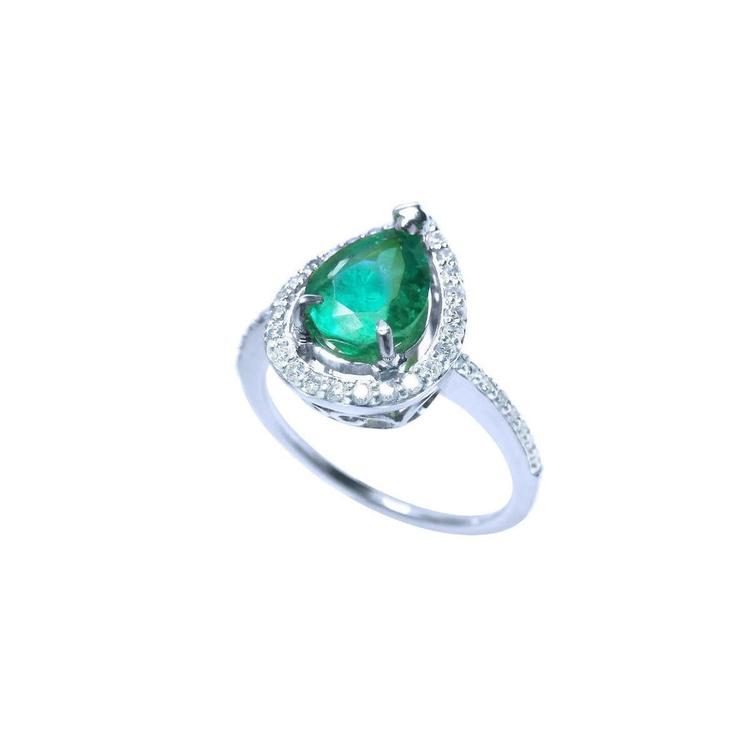 1.39 ct. teardrop emerald halo ring in 14K white gold with diamond accents.