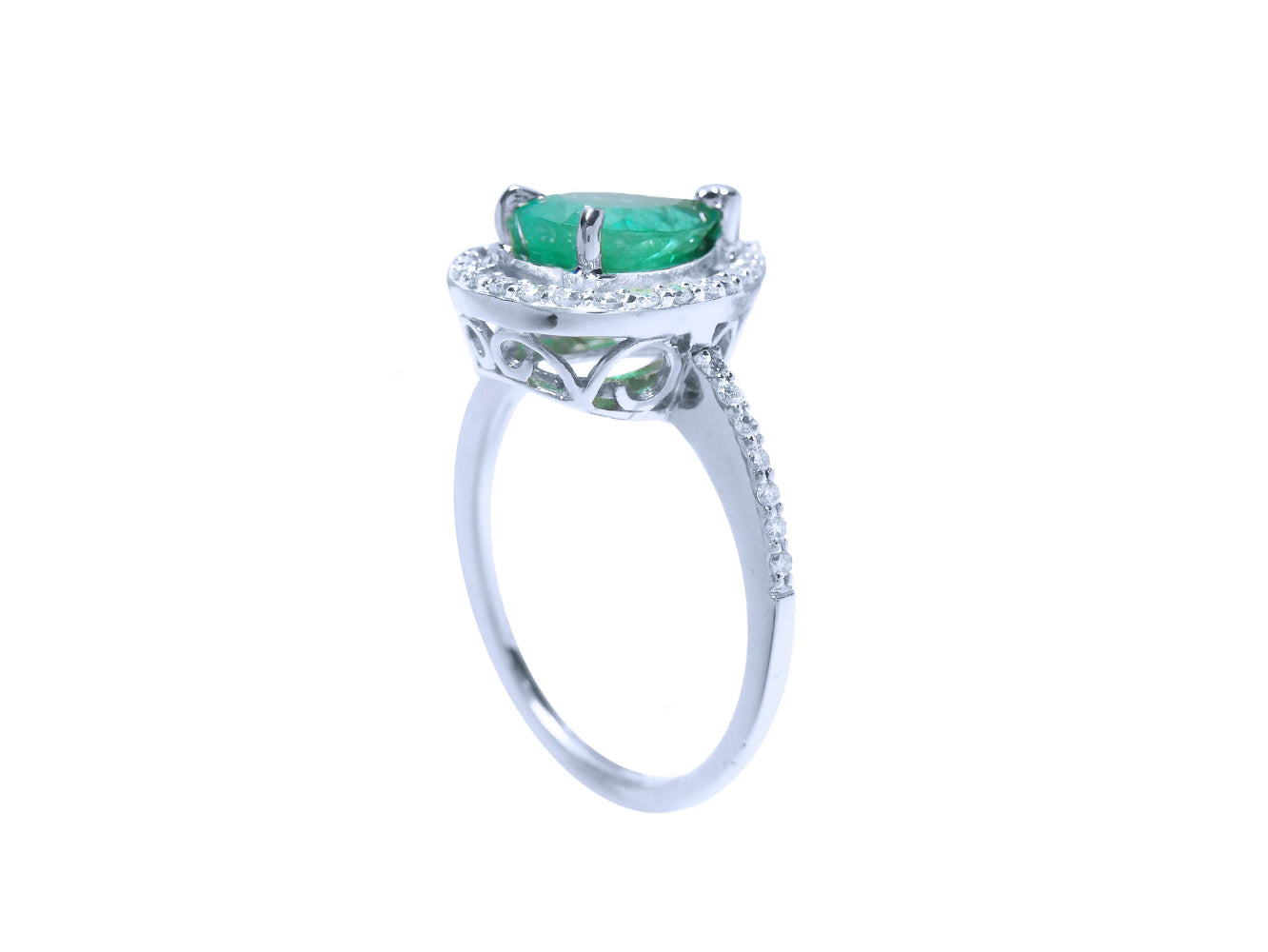The underside profile view of this natural colombian emerald ring in white gold.