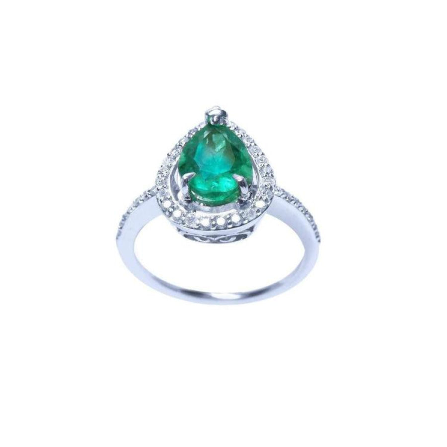 A teardrop natural emerald encircled in a halo diamond crafted in white gold topside view.