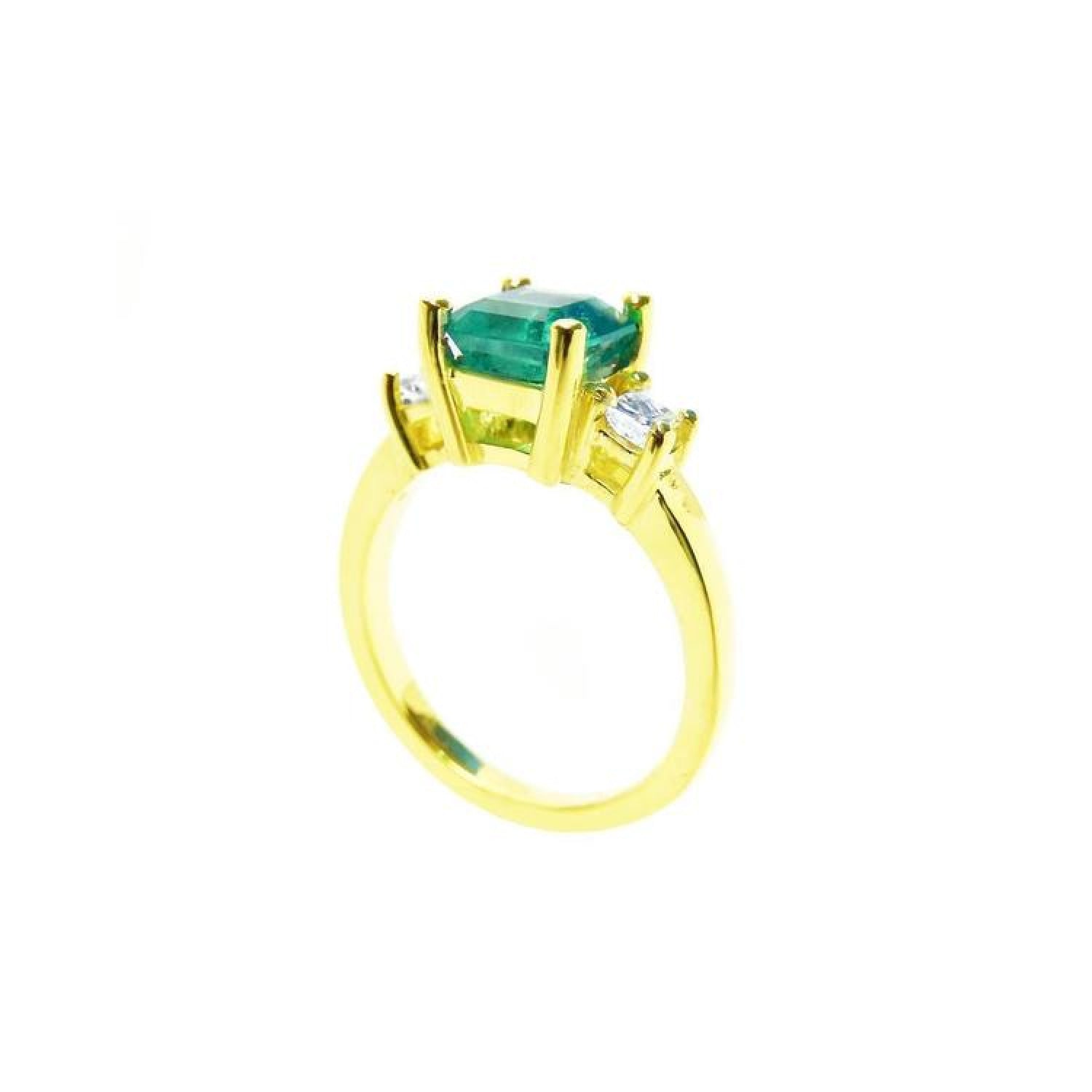 18K yellow gold three-stone ring with a square emerald and princess-cut side diamonds.