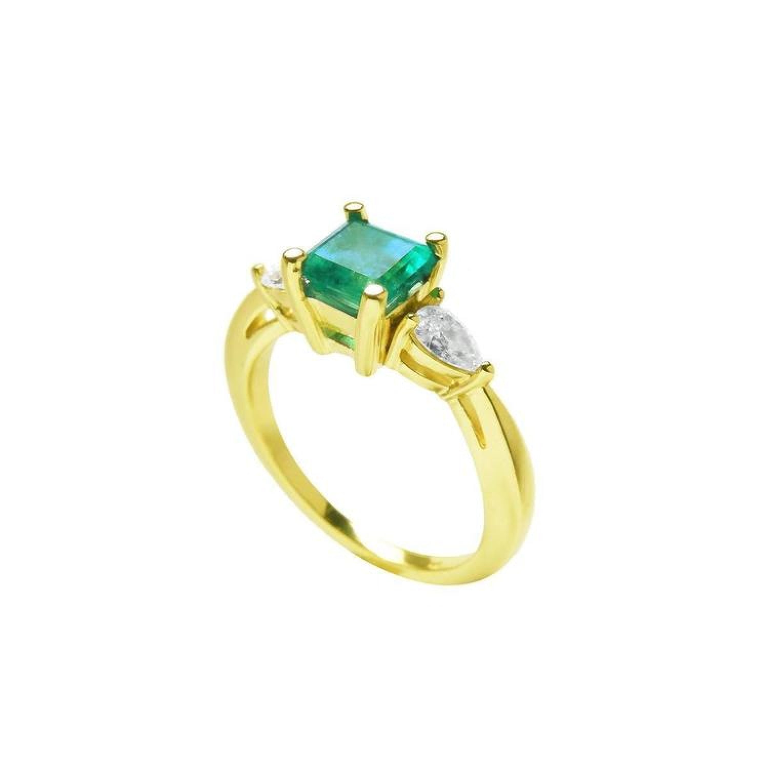 14K yellow gold three-stone ring with a vibrant emerald and two pear-shaped diamonds.