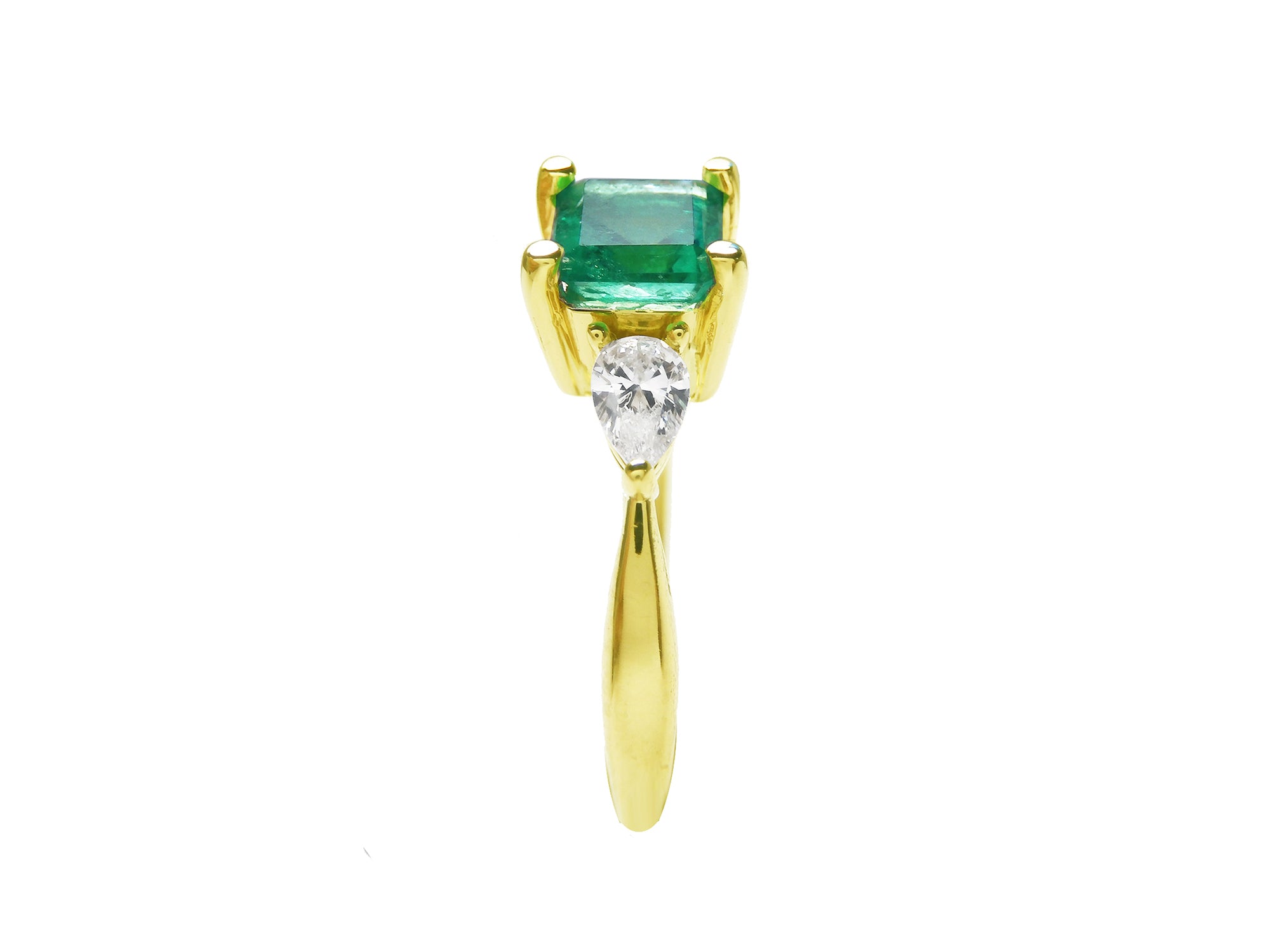 The side of this three stone ring for Mother&#39;s Day shows the top emerald and side diamond whit the band&#39;s ring.