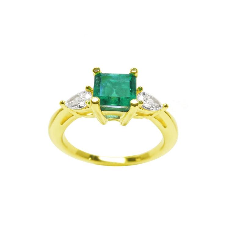 Natural colombian emerald with teardrop diamonds side ring for Mother's Day gift in yellow gold.