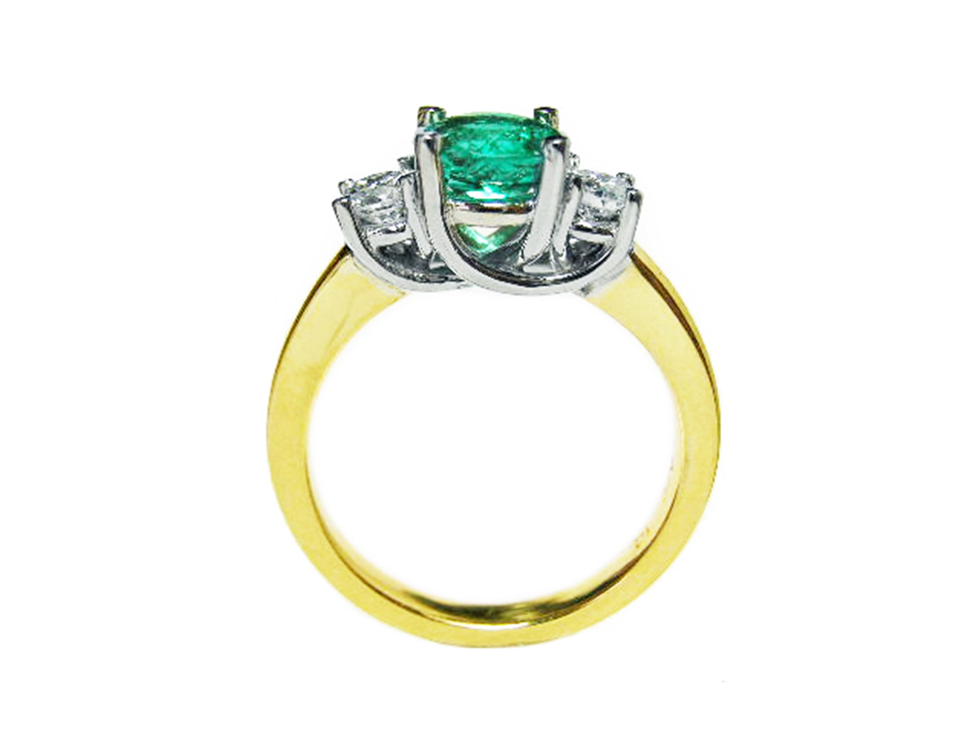 Lucida style emerald three stone ring and diamond accents on a white background.