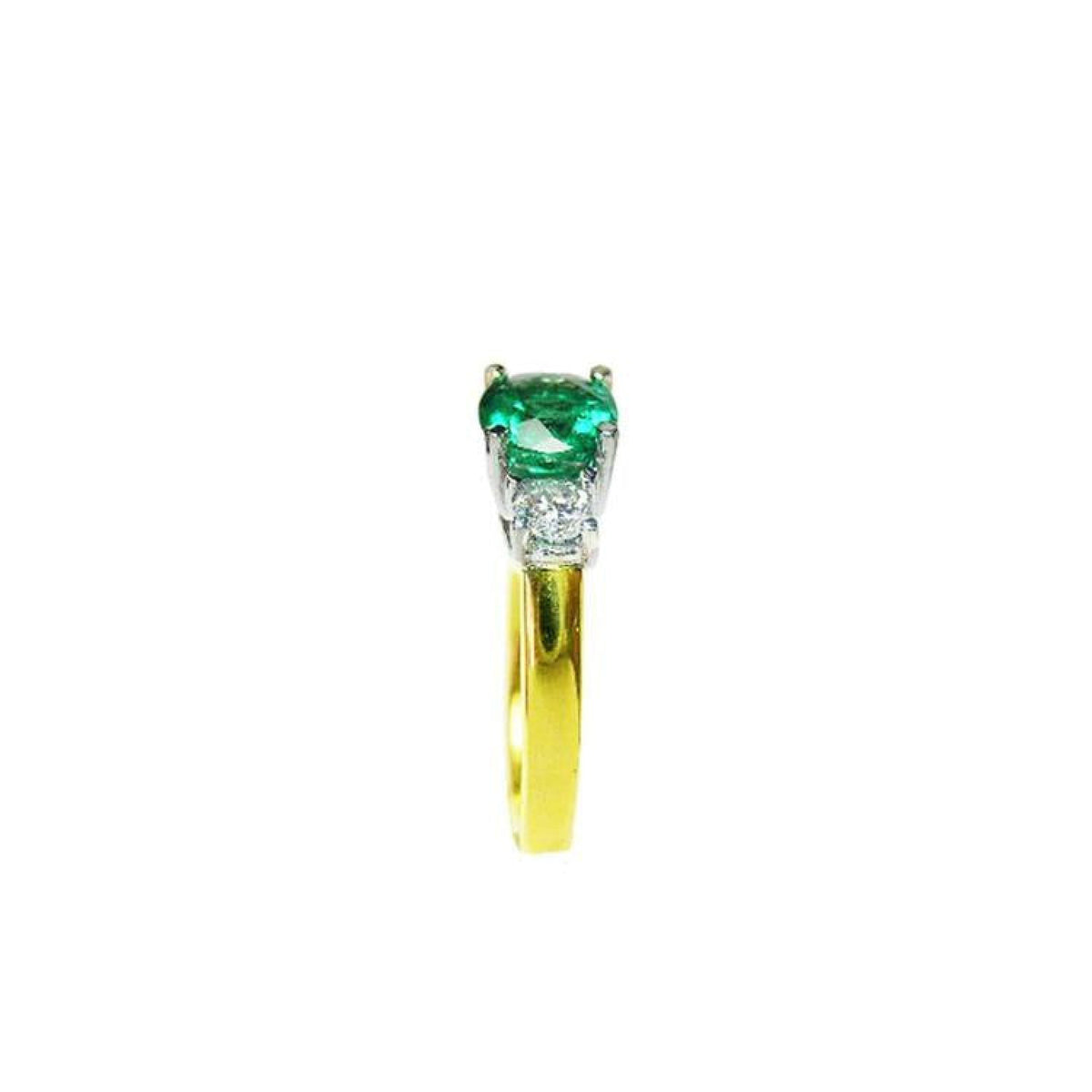 1.12 ct. round cut three stone emerald and diamond ring in 14k white and yellow gold.