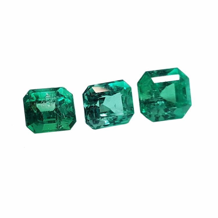 Three emerald-cut natural green emeralds, 1.93 carat matching set for jewelry.