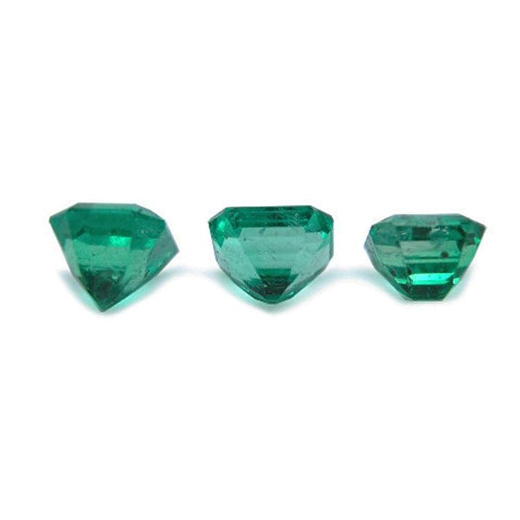Three emerald-cut natural green emeralds, 1.93 carat matching set from Muzo, Colombia.