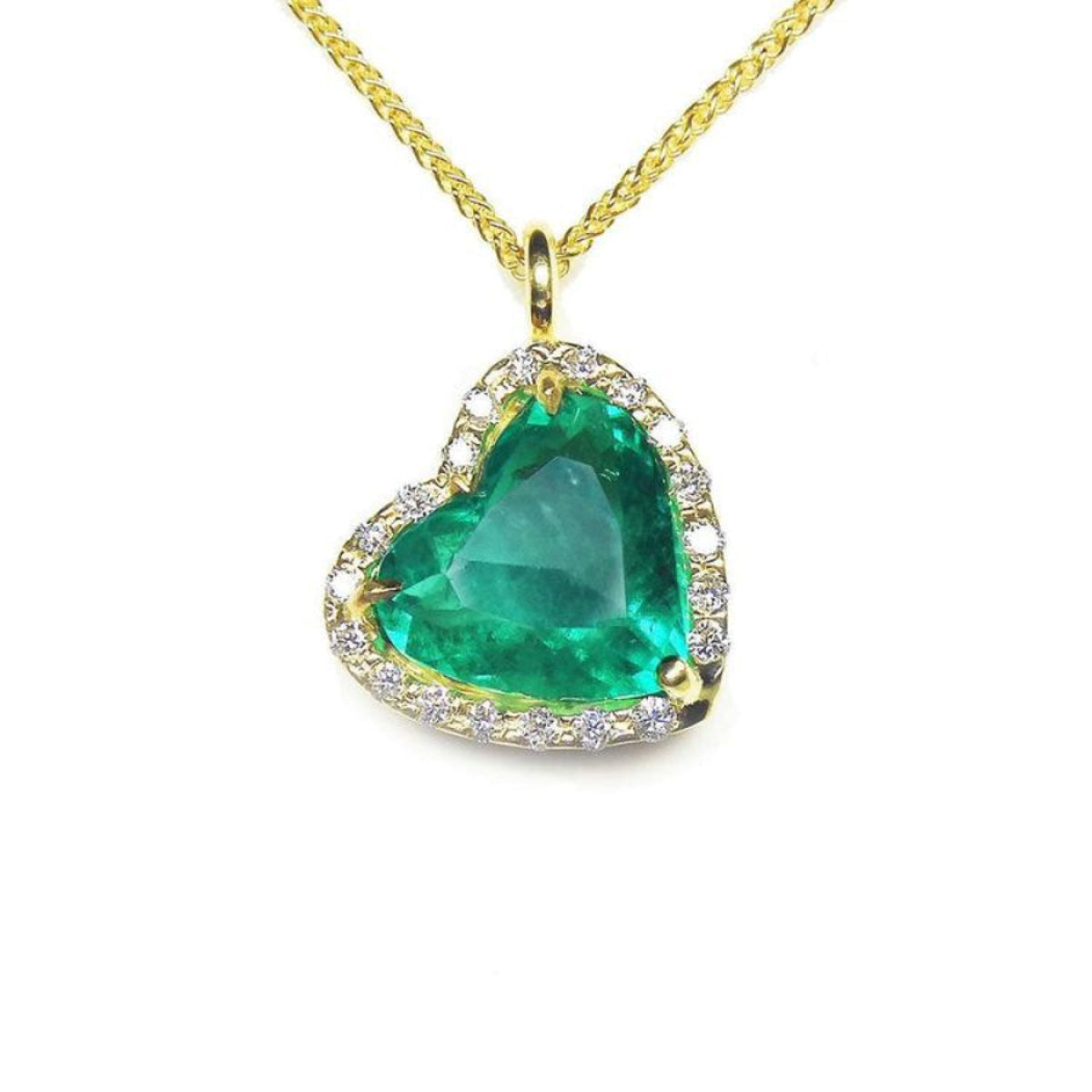 Gold necklace with a heart-shaped natural Muzo colombian emerald pendant.
