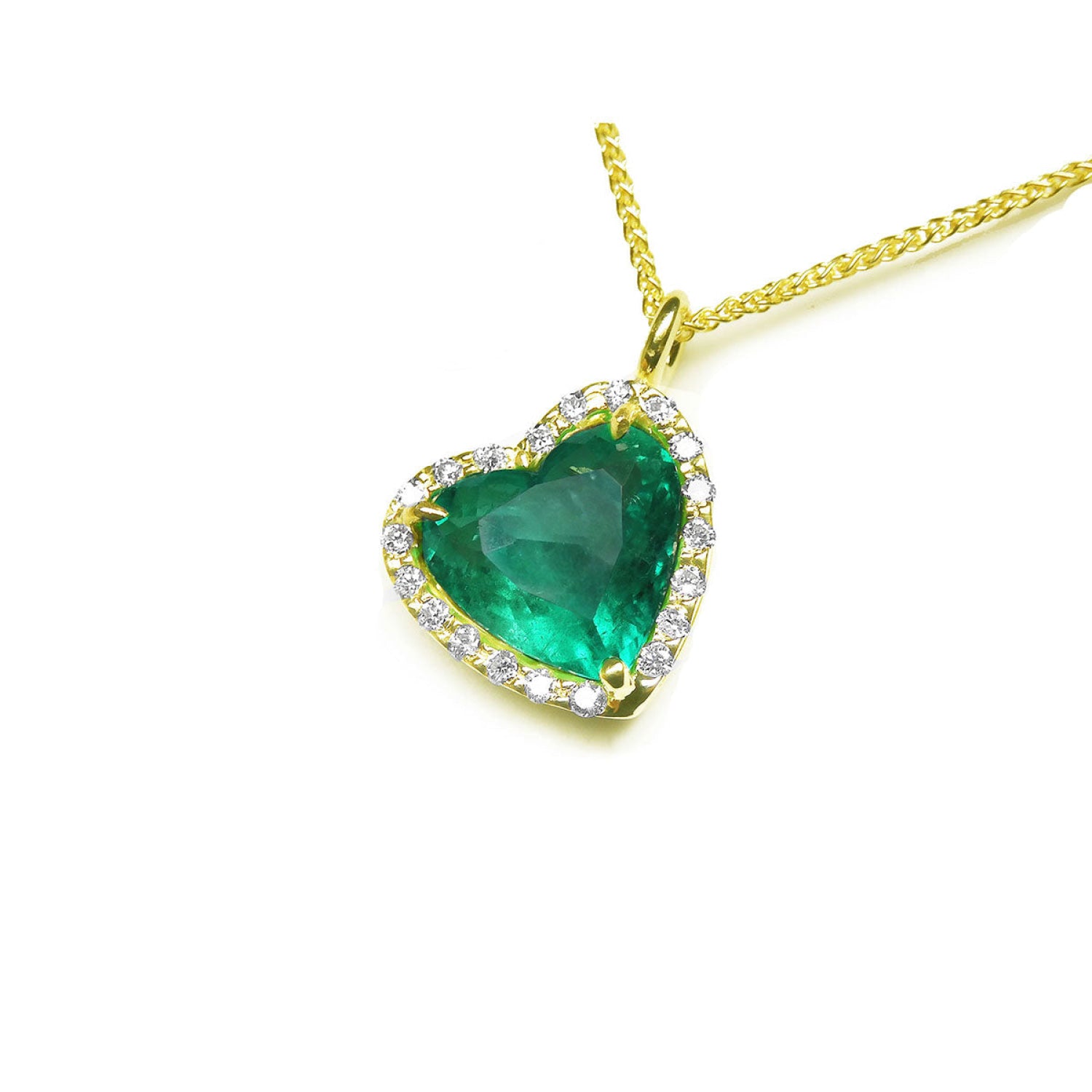 Tilted heart emerald necklace with halo diamonds in 18K yellow gold.