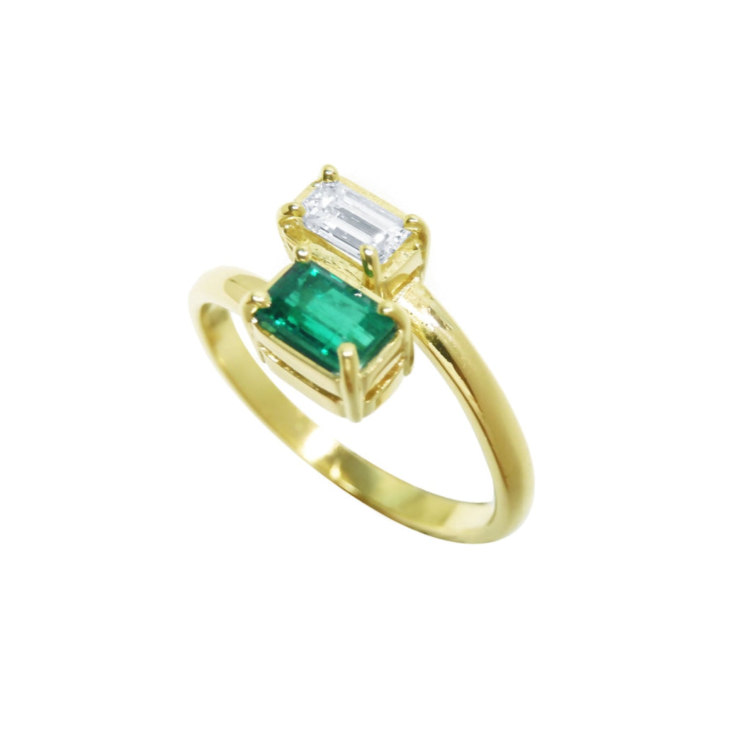 A yellow gold toi et moi ring with emerald and diamond crafted in 18k gold.