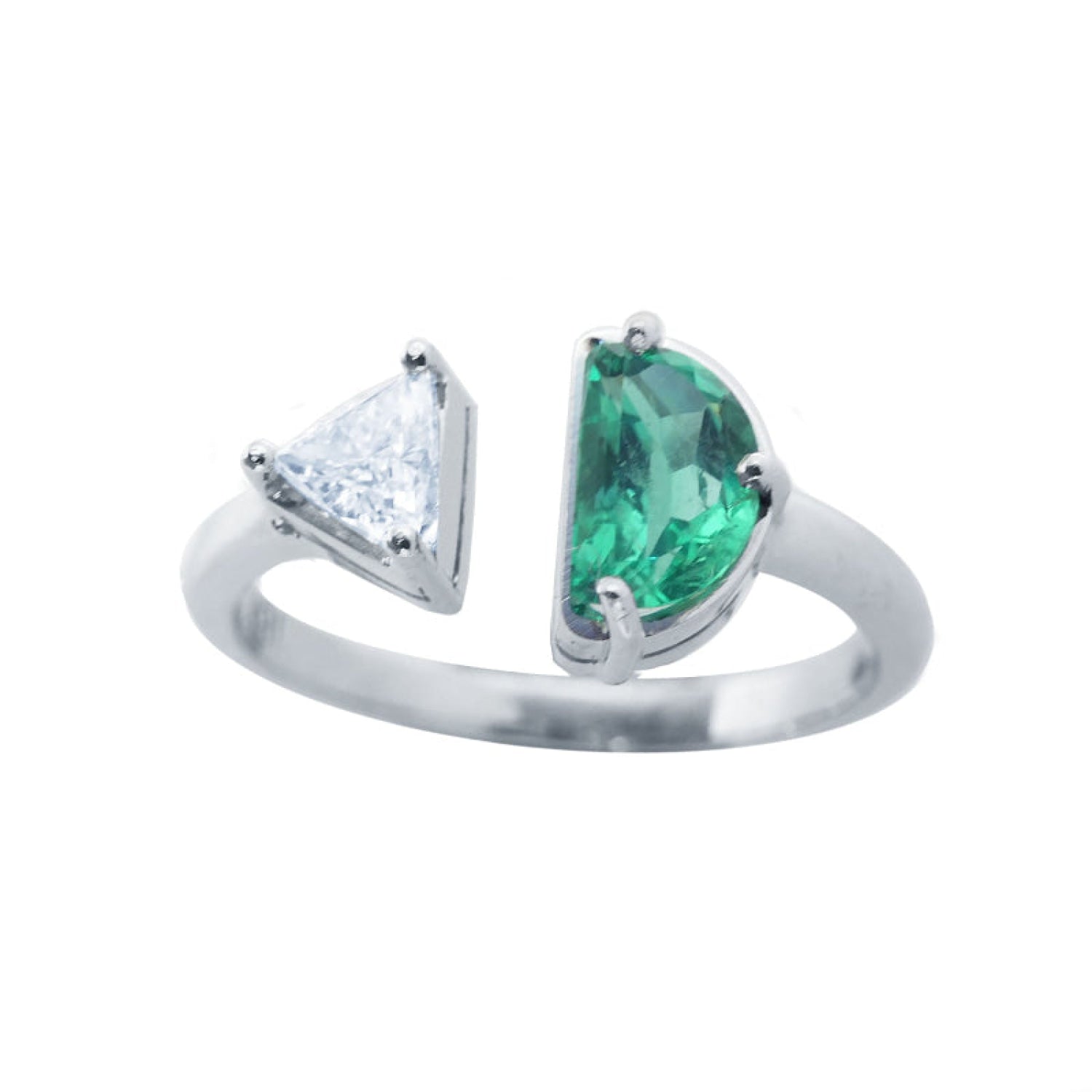 This negative space Toi et Moi ring features a half-moon-shaped natural Colombian emerald and a trillion-cut diamond.