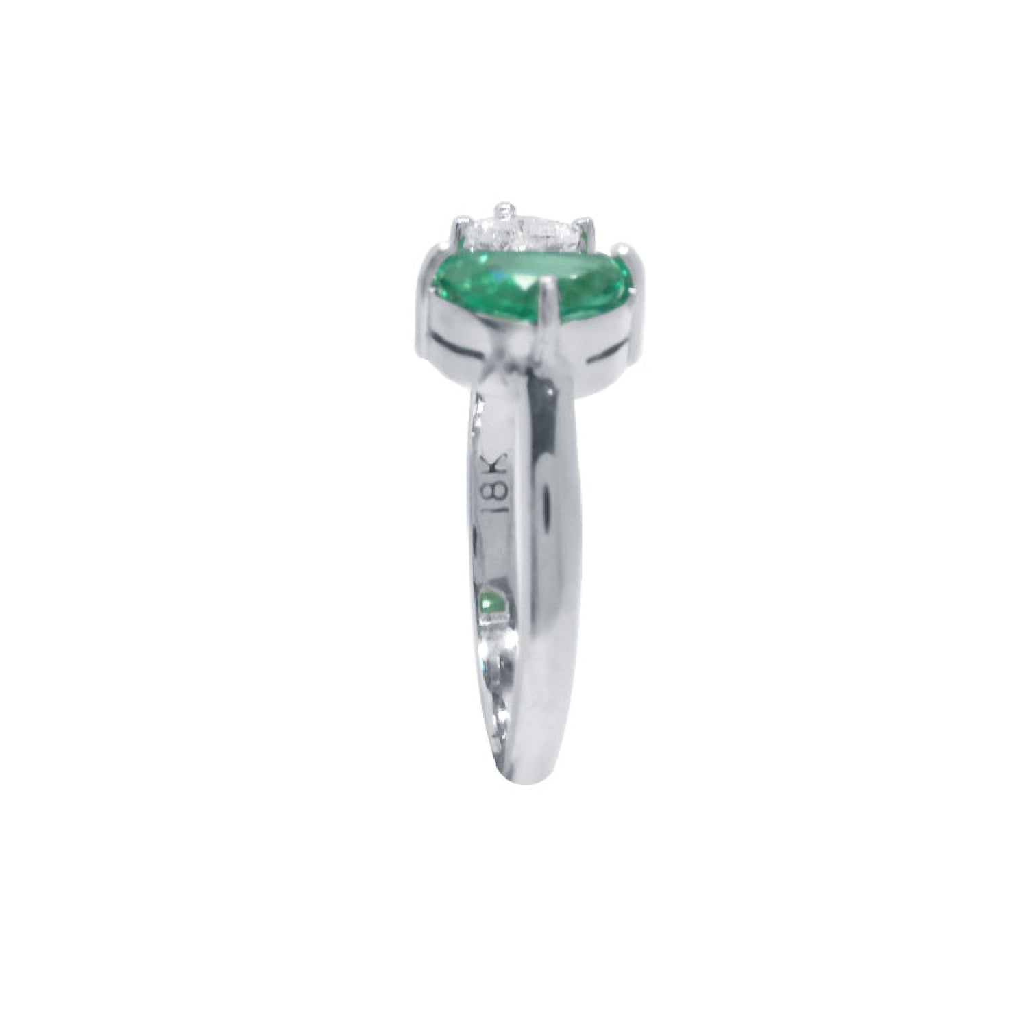 Negative space Toi et Moi ring the emerald showcases fine quality with its distinctive fancy cut, while the geometric trillion diamond creates striking visual contrast.