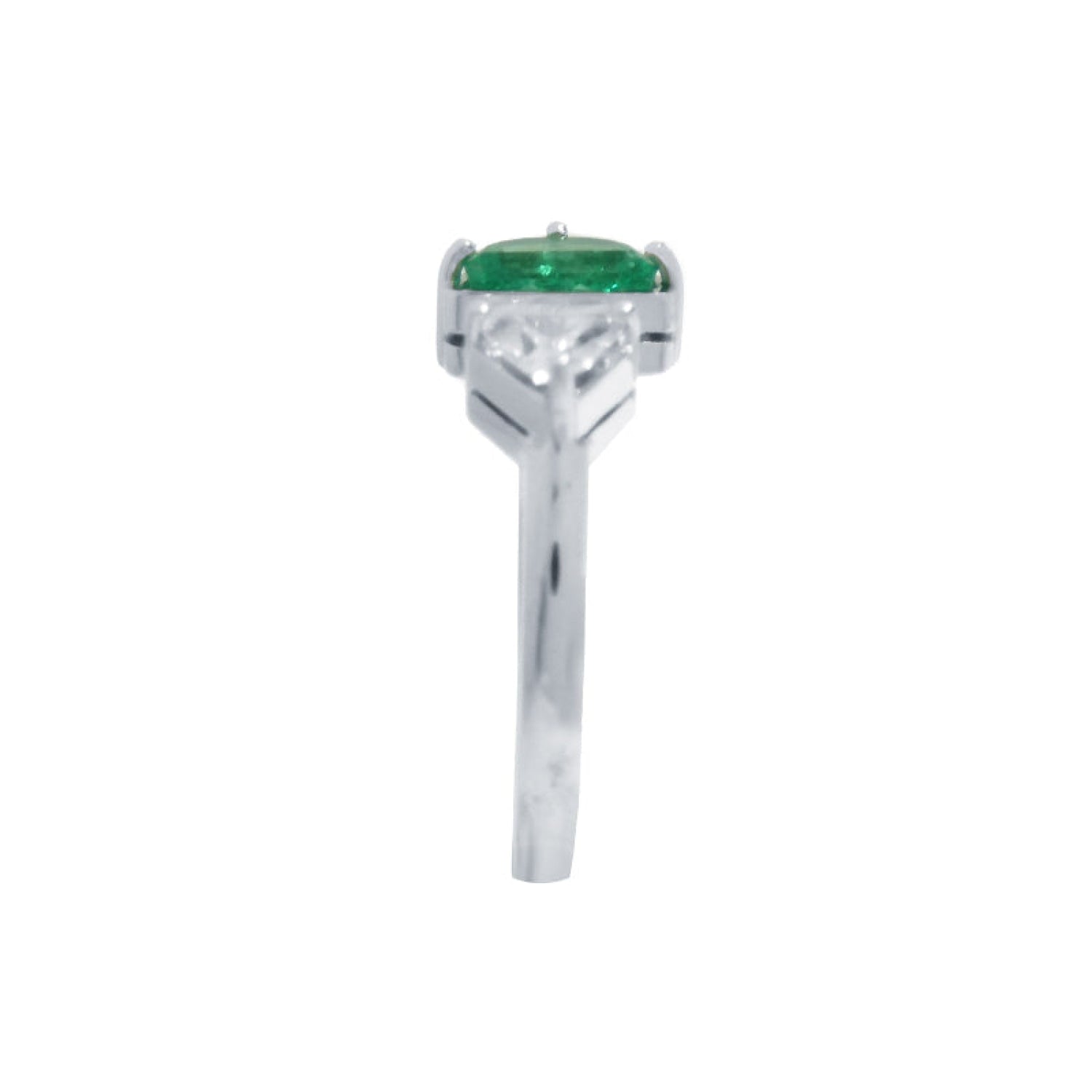 The emerald showcases fine quality with its distinctive fancy cut, while the geometric trillion diamond creates striking visual contrast.
